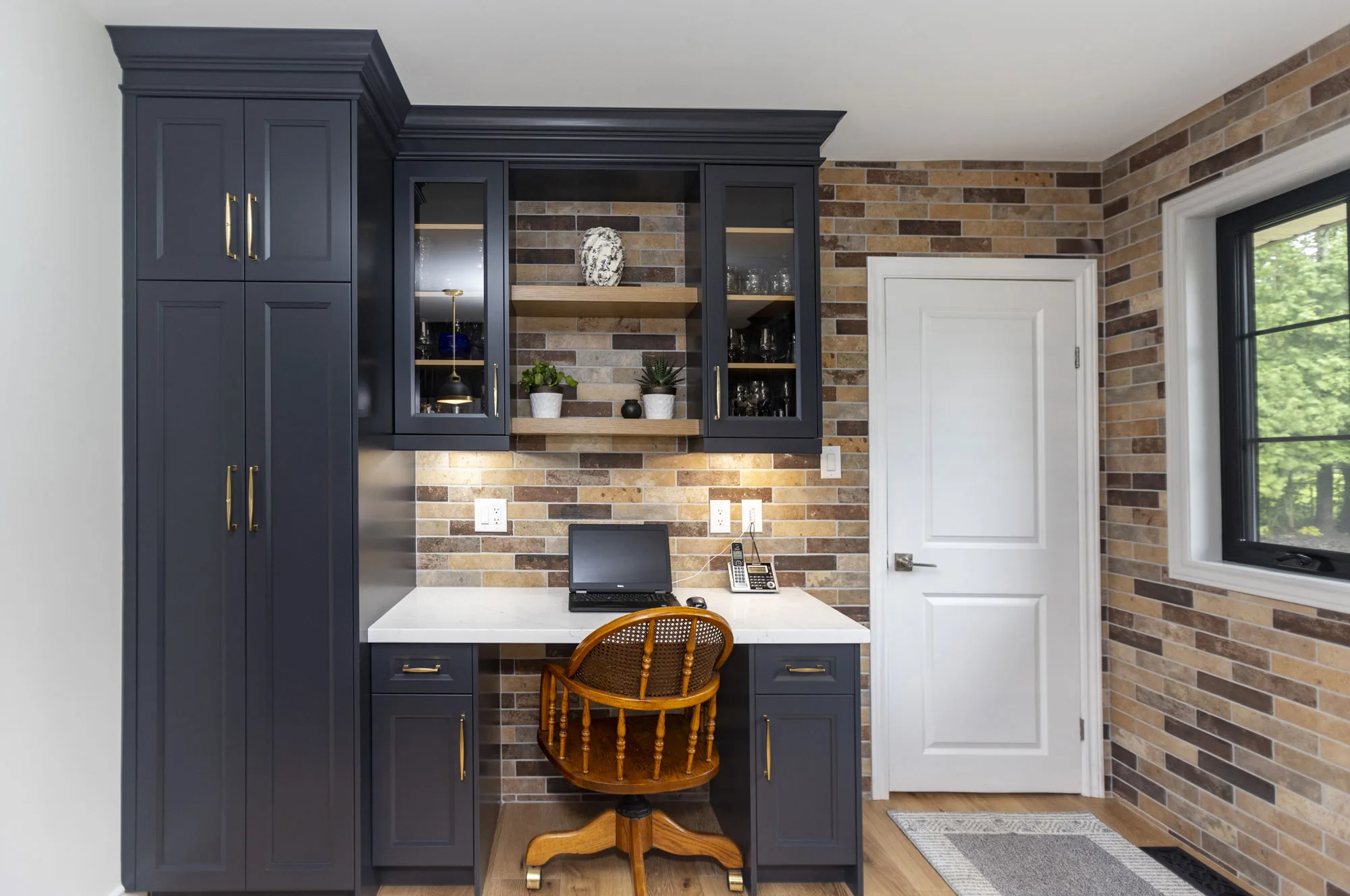 A office work area with dark navy cabinetry